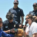 Genete shows firefighters how to give oxygen to pets during critical care times.