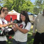 Jr Vet youth Lavonne Ball & Jade Sigmund explain Animal Triage as Mayor O'Mally looks on.  