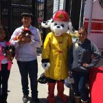 Jr Vets pose with a fire dog & our fire pup Liesel at an event. 